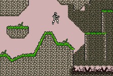 Screenshot of a 2D game, sideview, pixel graphics. A light gray stone cave with a pink background and a soldier-like figure with a rifle.